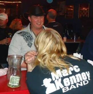 Marc Kenney with a fan wearing a Marc Kenney Band shirt