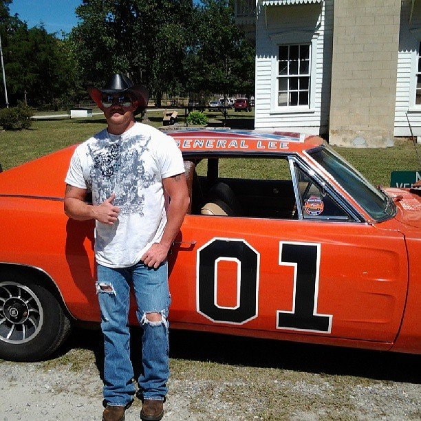 Marc Kenney posing with the General Lee car